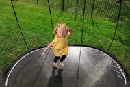 Load image into Gallery viewer, girl jumping on a trampoline
