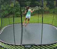 Load image into Gallery viewer, girl jumping on an outdoor trampoline