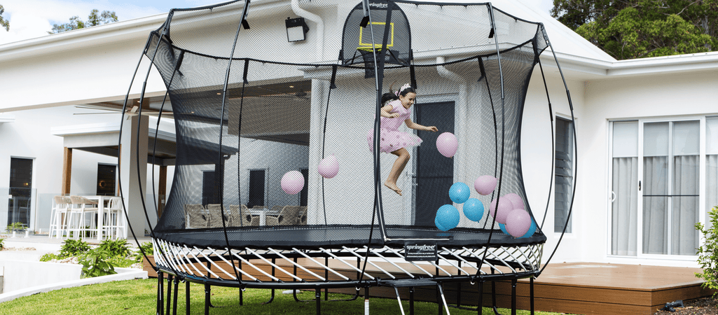 Trampoline vs Jumping Castle for Your Backyard