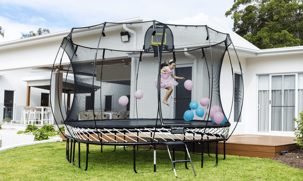 Trampoline vs Jumping Castle for Your Backyard