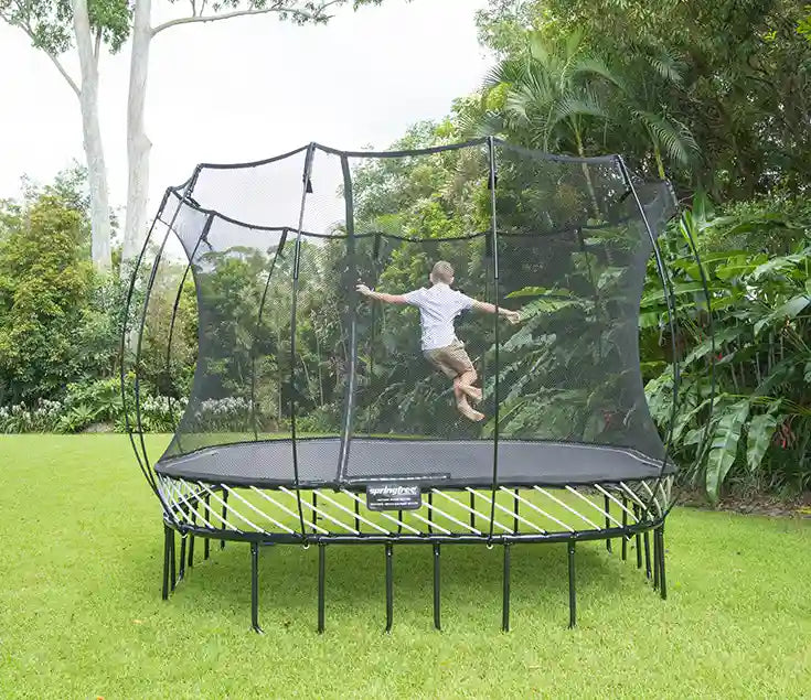 boy jumping around on a trampoline