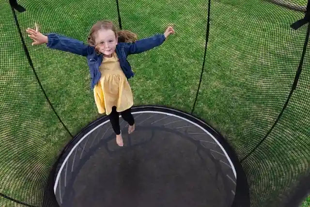 girl jumping on a trampoline