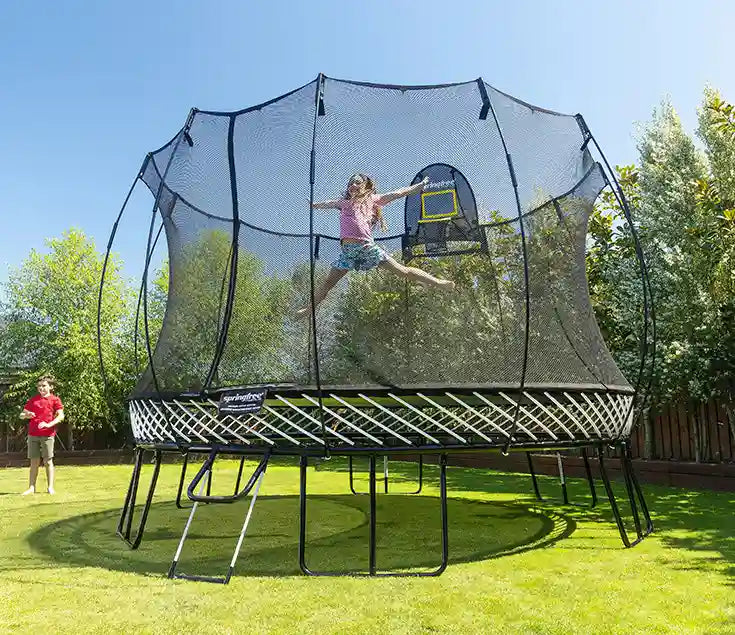 girl jumping very high on a trampoline