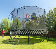 Load image into Gallery viewer, girl jumping very high on a trampoline
