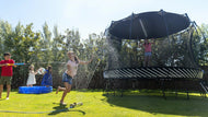 Load image into Gallery viewer, girl playing on a trampoline with a sun shade
